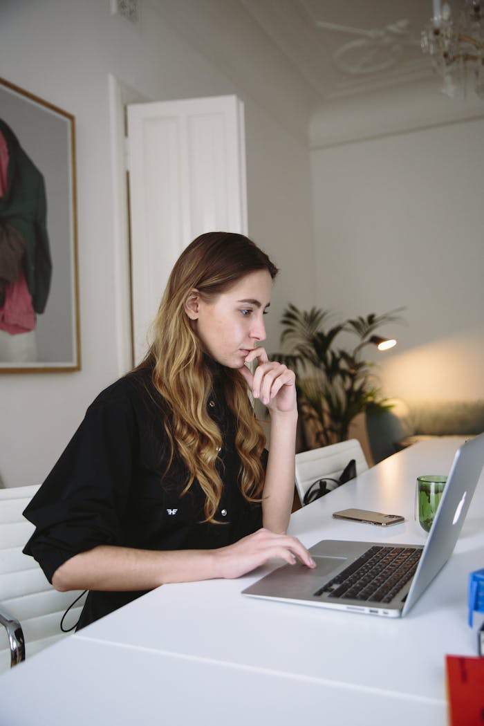 Photo Of Woman Using Laptop